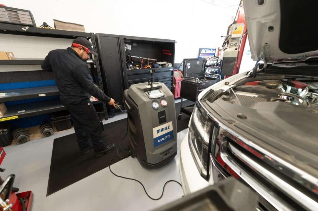 The refrigerant recovery and recharge machine hooked up during AC service at Chuck's Auto Repair