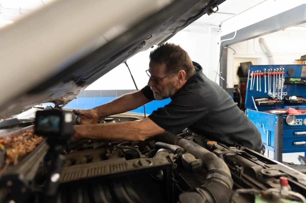 An experienced technician performing engine repair at Chuck's Auto Repair North Seattle