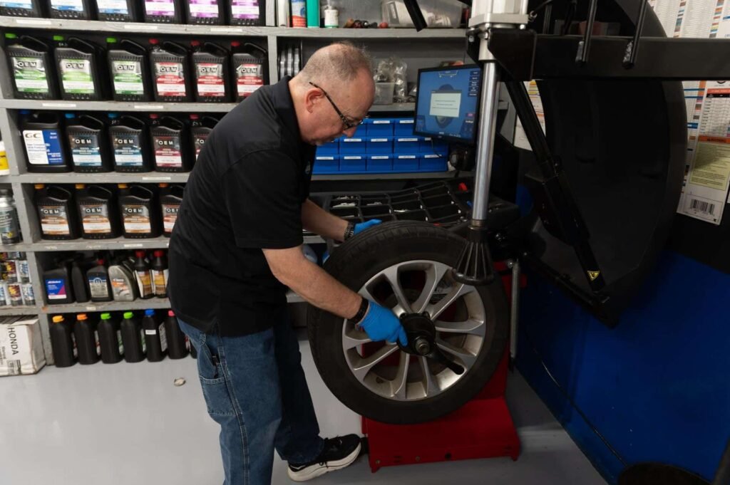A technician balancing a wheel at Chuck's Auto Repair North Seattle