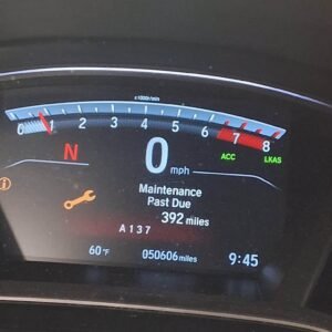 Honda Civic dashboard displaying Maintenance Minder code A137 and a maintenance-past-due message.