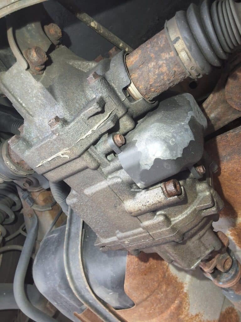Rear differential fluid being serviced on an AWD Honda.