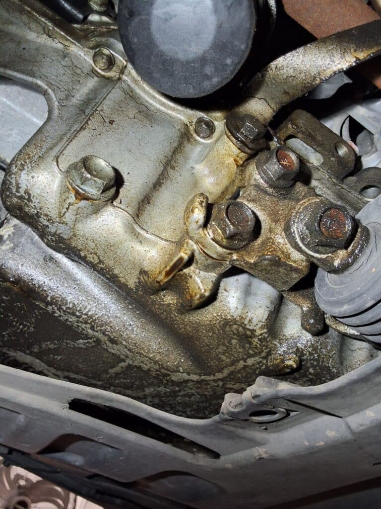 Transmission fluid being serviced on a Honda at Chuck’s Auto Repair – North Seattle.