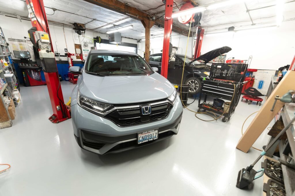 Honda CR-V inside Chuck’s Auto Repair – North Seattle service bay.