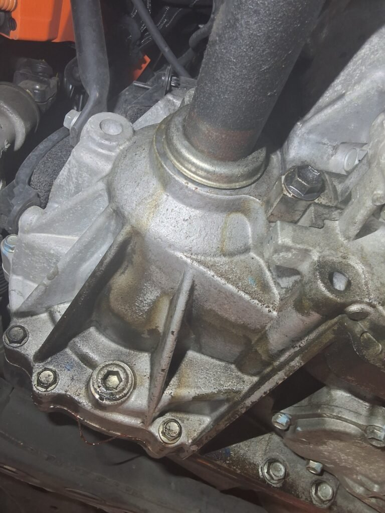 Transmission and CV axle seal area inspected on a 2015 Lexus RX450h.