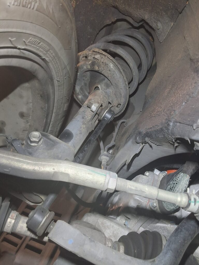 Suspension strut inspected on a 2015 Lexus RX450h.