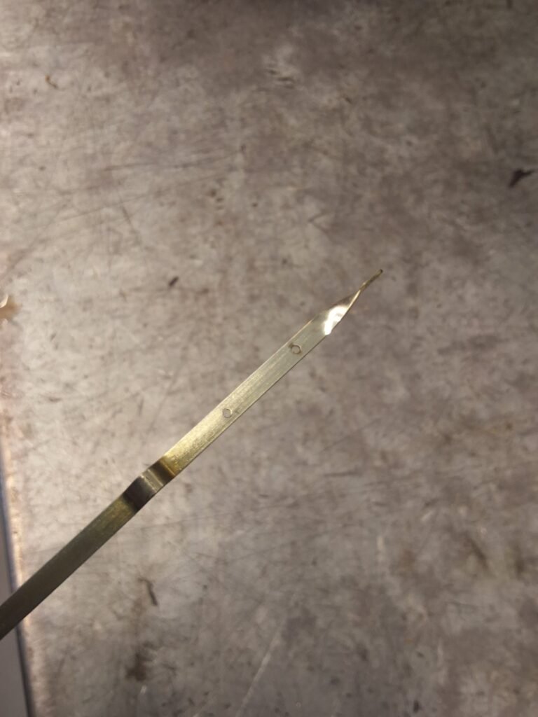 Dipstick checked on a Honda CR-V after the engine was found extremely low on oil.